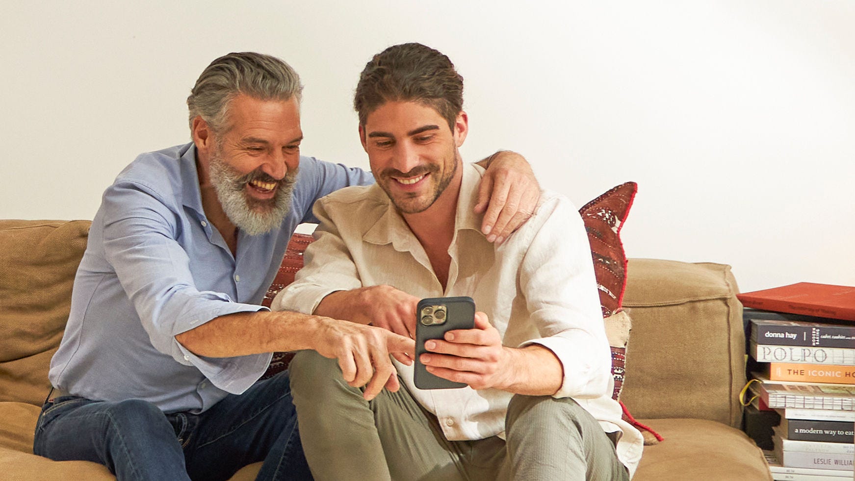 Father and son discussing the advantages of subsidies for installing aerothermal equipment.